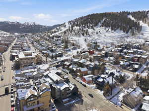 Snowy aerial view featuring a mountain view