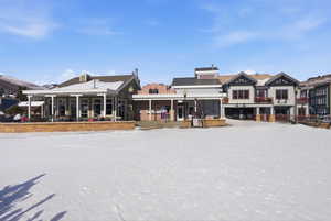 Back of house with a deck