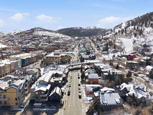 Snowy aerial view featuring a mountain view