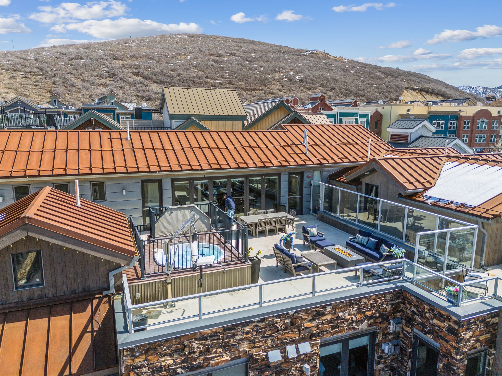 Exterior space with a mountain view, outdoor lounge area, and a standing seam roof