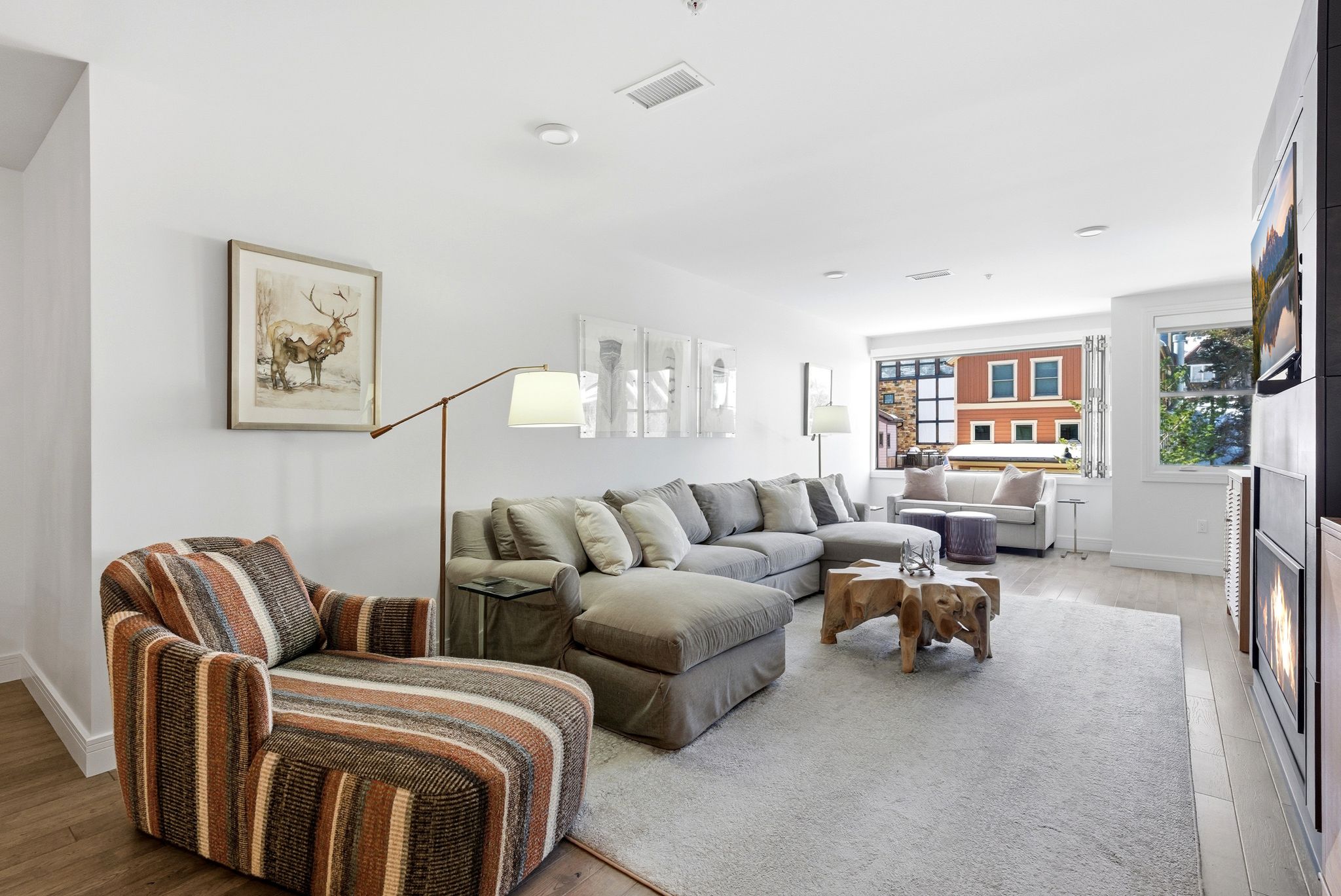 Living room featuring light wood-type flooring and baseboards