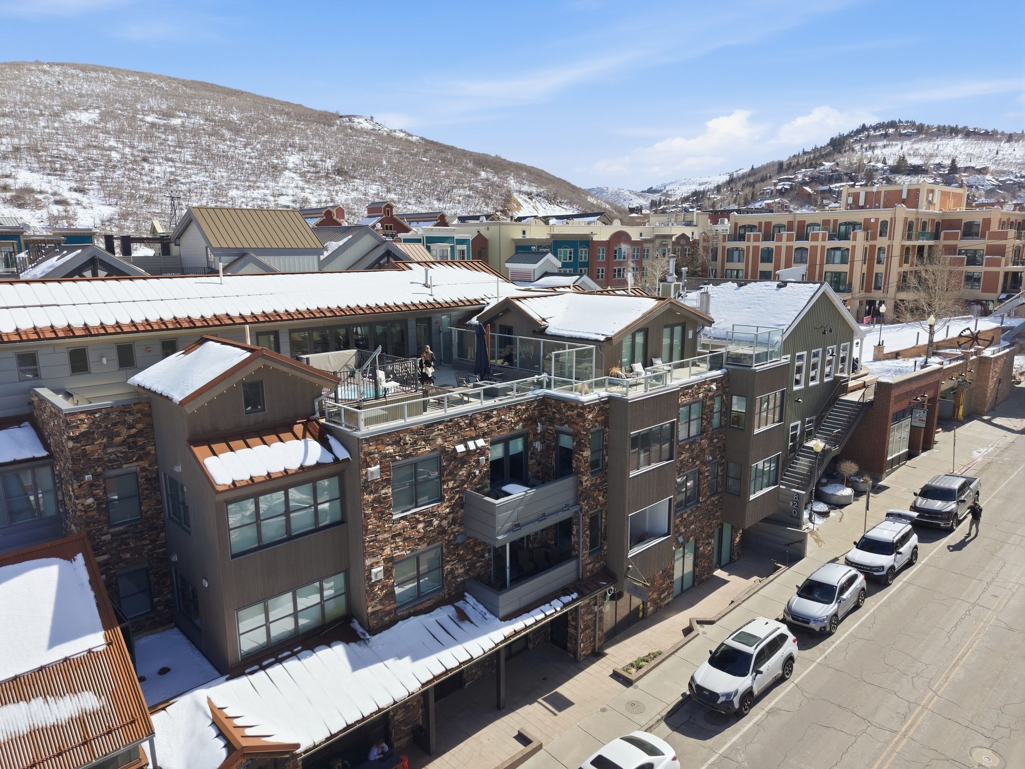 Snow covered building featuring a mountain view