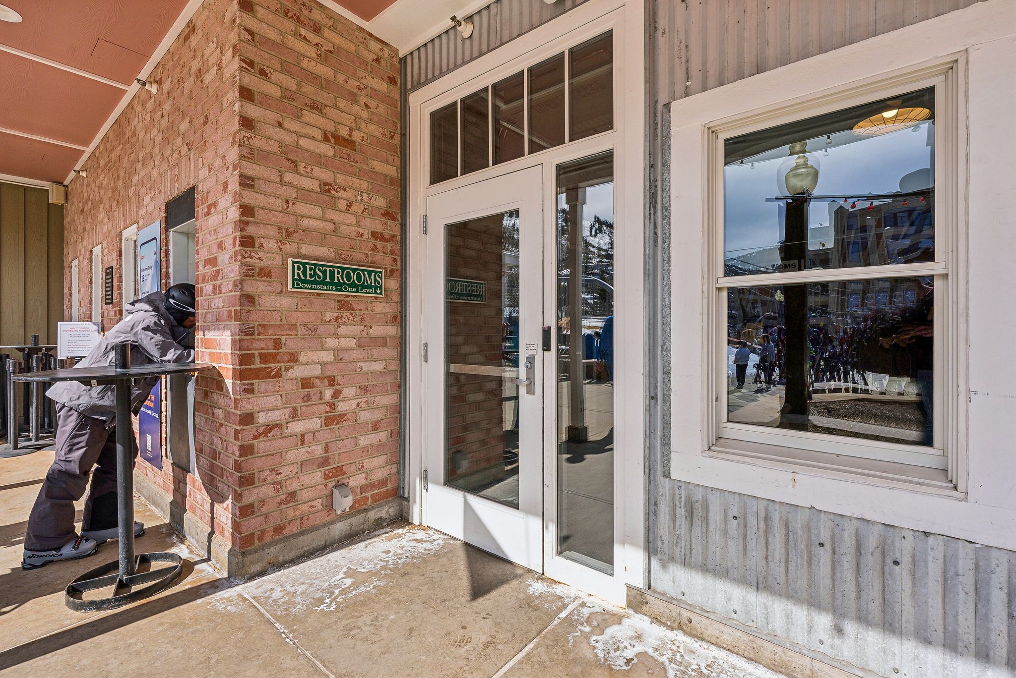 Entrance to property featuring brick siding