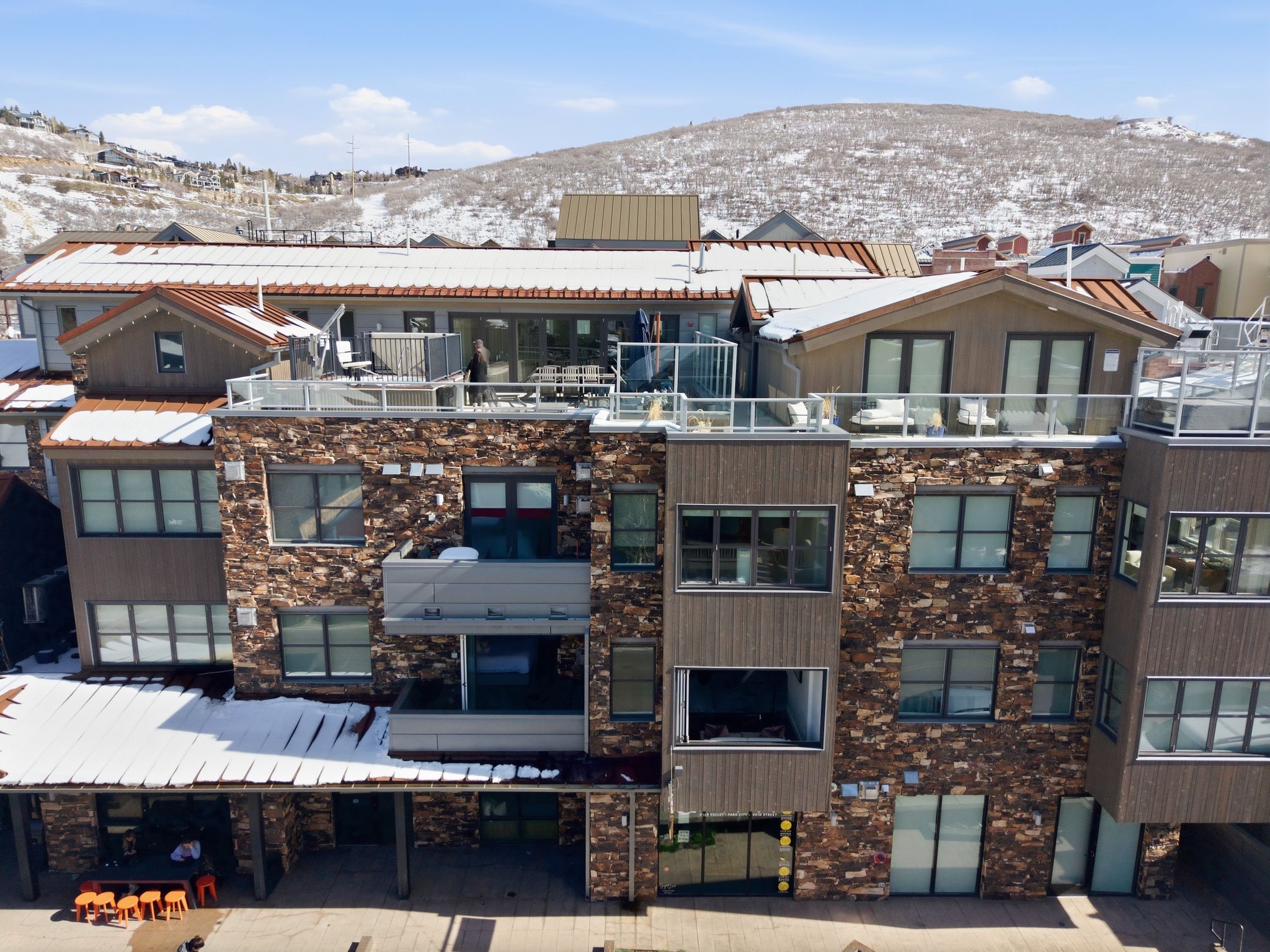 Snow covered property with a mountain view