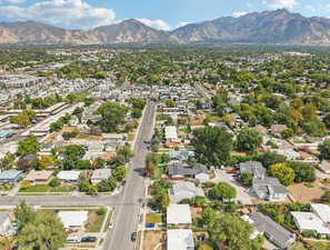Aerial perspective of suburban area featuring a mountainous background