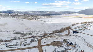 Snowy aerial view with a mountain view