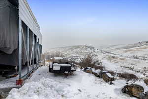 Snowy yard with a mountain view