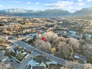 Birds eye view of property with a mountain view and a residential view
