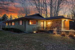 View of front of property with a front lawn and brick siding