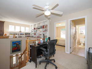 Office with ceiling fan, a textured ceiling, and carpet