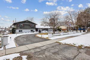 View of front of property featuring aphalt driveway