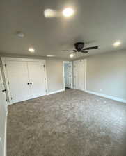 Unfurnished bedroom with baseboards, carpet, and recessed lighting