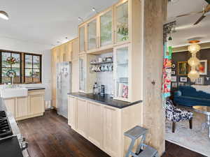 Kitchen featuring a sink, light brown cabinets, dark wood-type flooring, and stainless steel fridge with ice dispenser