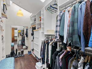 Spacious closet featuring hardwood / wood-style floors