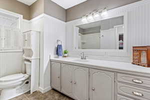 Full bath with toilet and vanity