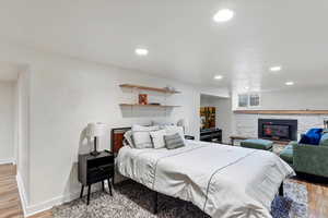 Bedroom featuring recessed lighting, baseboards, and light wood-style flooring