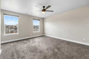 Master Bedroom Unfurnished room featuring baseboards, carpet, visible vents, and ceiling fan
