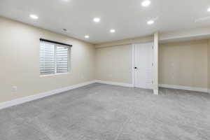 Basement featuring carpet, recessed lighting, and baseboards