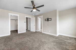 Master Bedroom Unfurnished bedroom featuring a spacious closet, visible vents, baseboards, and carpet floors