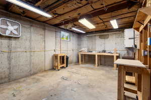 Unfinished below grade area with a workshop area
