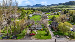 Birds eye view of property with a residential view and a mountain view