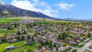 Drone / aerial view featuring a residential view and a mountain view