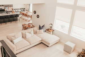 Living area featuring light wood-type flooring and baseboards
