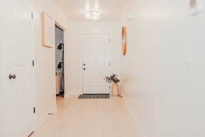 Corridor with wood finished floors and baseboards
