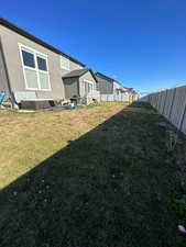 View of yard featuring fence