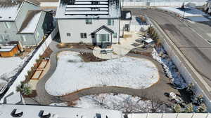 Snowy aerial view featuring a residential view