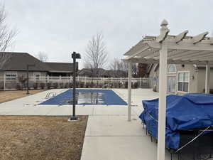 View of pool with a patio, a fenced in pool, a fenced backyard, a pergola, and grilling area
