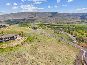 Overview of rural landscape featuring a mountainous background