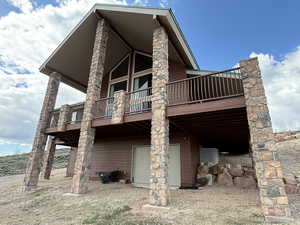 Back of property with a wooden deck