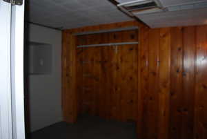 Interior space featuring wood walls