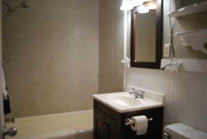 Full bath with shower / tub combination, toilet, and vanity