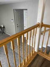 Stairway featuring baseboards