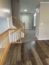 Stairway featuring recessed lighting, baseboards, and wood finished floors