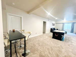Game room featuring visible vents, baseboards, beam ceiling, and carpet flooring