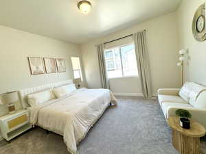 Master Bedroom carpeted bedroom with baseboards