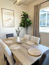 Dining area with an inviting chandelier