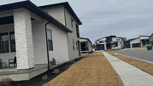 View of side of home with a residential view
