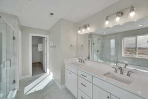 Bathroom with a sink, visible vents, marble finish floor, and a stall shower