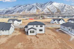 Birds eye view of property featuring a mountain view and a residential view