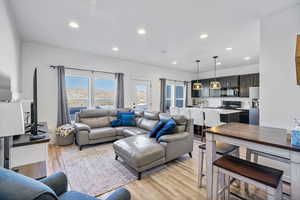 Living room featuring recessed lighting and light wood-style floors