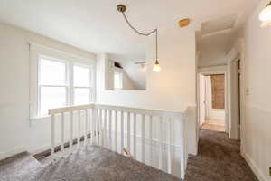 Corridor with carpet flooring