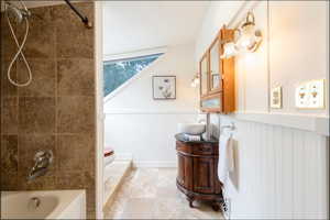 Full bathroom, tile shower and floor.