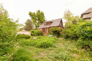 View of back yard with fence
