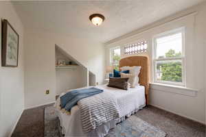 Second bedroom on upper level, with a lot of light and beautiful original windows.