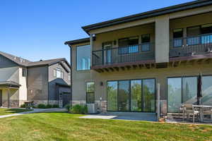 View of building exterior with central AC unit