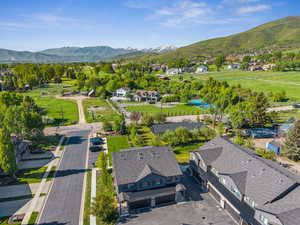 Aerial view of residential area featuring mountains